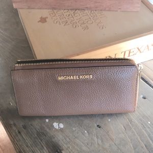 Michael Kors zippered wallet.